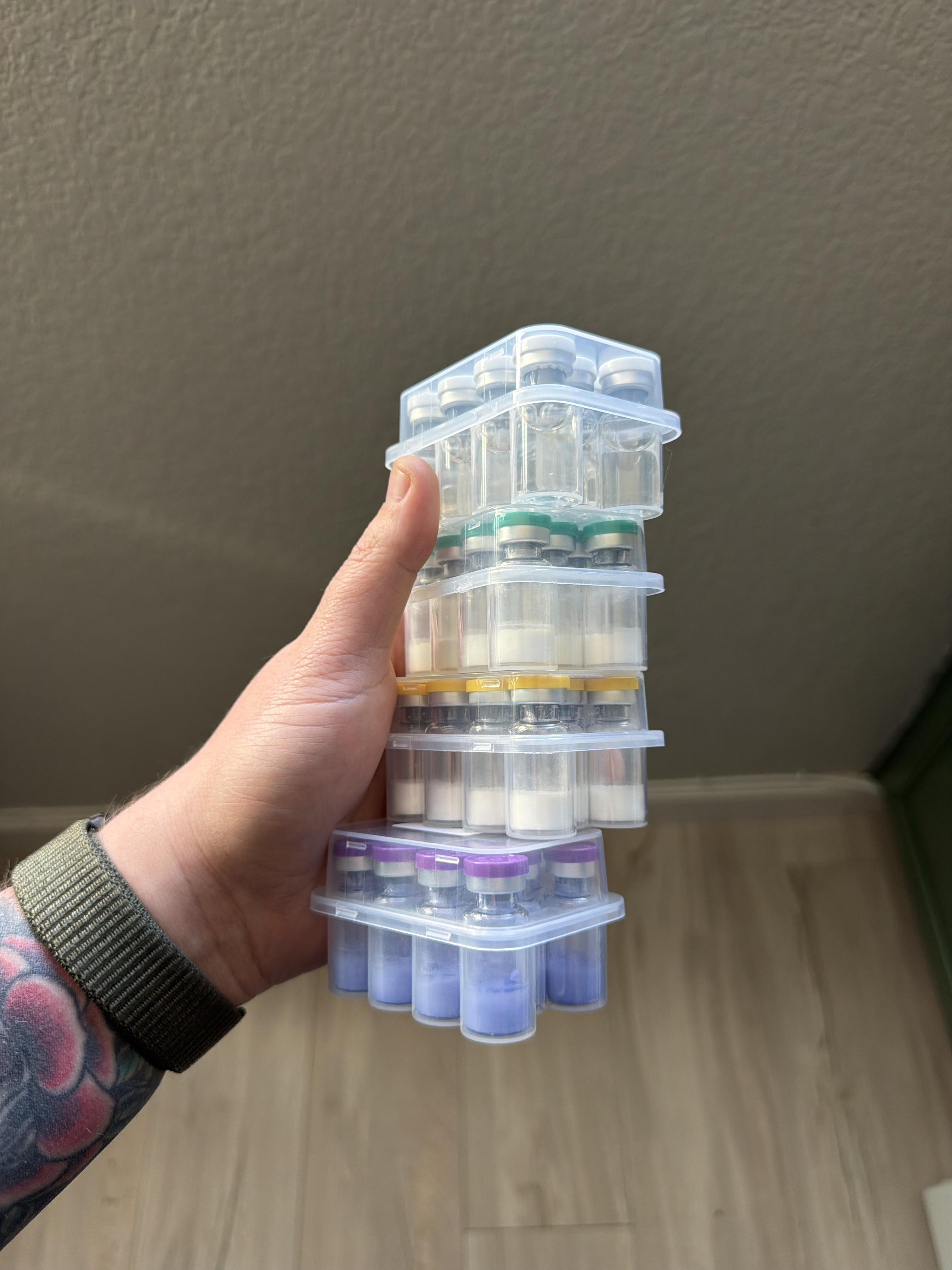 Stacked peptide vial cases with colour-coded caps